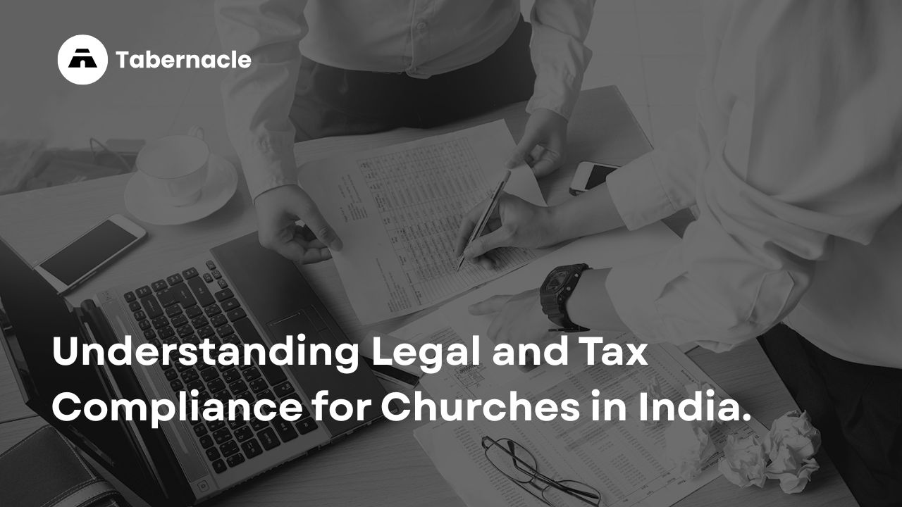 A close-up of professionals reviewing financial and legal documents, representing the essential compliance steps for Indian churches discussed below.